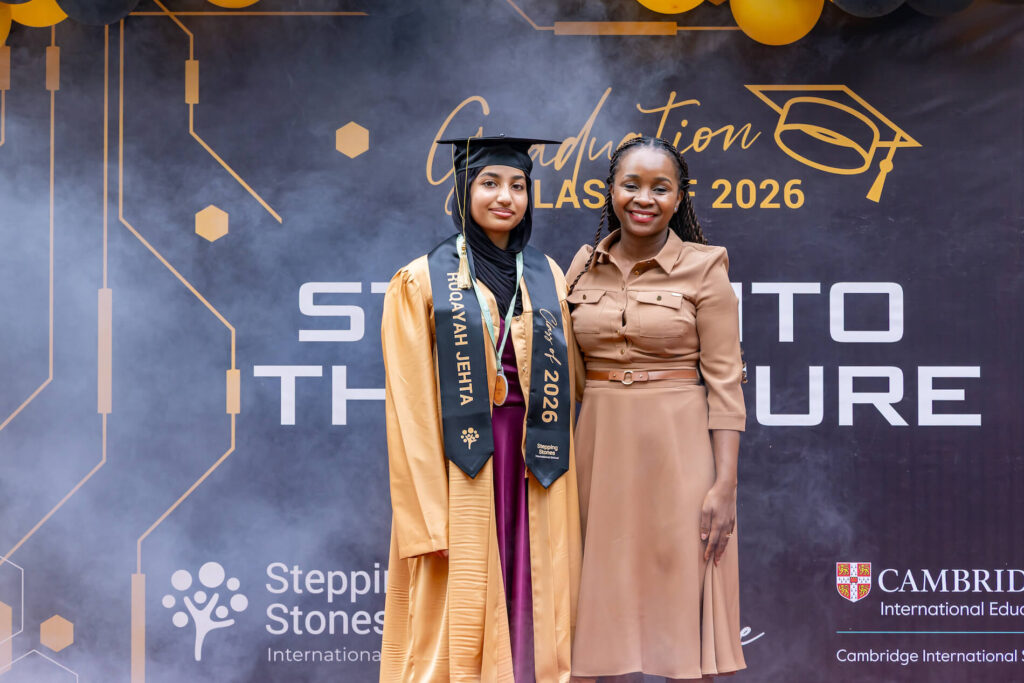 Stepping Stones Graduation 2026 - Teacher and Student Posing
